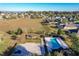 Aerial view of community with pool, playground, and homes at 12532 Hammock Pointe Cir, Clermont, FL 34711