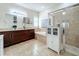 Elegant bathroom featuring double vanities and a large shower at 12532 Hammock Pointe Cir, Clermont, FL 34711