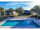 Inviting community pool with plenty of lounge chairs for sunbathing at 12532 Hammock Pointe Cir, Clermont, FL 34711