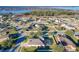 Aerial perspective showcasing the community near a lake at 12532 Hammock Pointe Cir, Clermont, FL 34711