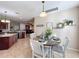 Casual dining area with view into kitchen at 12532 Hammock Pointe Cir, Clermont, FL 34711