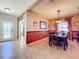 Elegant dining room with dark wood table and window treatments at 12532 Hammock Pointe Cir, Clermont, FL 34711