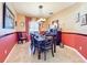 Bright dining room featuring a spacious table, chandelier, and rich colored walls at 12532 Hammock Pointe Cir, Clermont, FL 34711