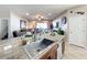 Kitchen with stainless steel sink, breakfast bar, and view into living room at 12532 Hammock Pointe Cir, Clermont, FL 34711