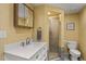 Bathroom with shower, toilet and modern vanity at 1319 Stowe Ave, Mount Dora, FL 32757