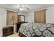 Cozy bedroom with dresser, bed, and ceiling fan at 1319 Stowe Ave, Mount Dora, FL 32757