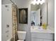 Modern bathroom with shower/tub combo, vanity, and stylish decor at 13243 Peaceful Melody Dr, Winter Garden, FL 34787