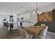 Dining room with wood table, modern chandelier, and stylish decor at 13243 Peaceful Melody Dr, Winter Garden, FL 34787