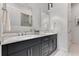 Elegant bathroom with double vanity, modern fixtures and a large mirror at 133 S Park Ave, Winter Garden, FL 34787