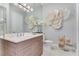 Modern bathroom boasts a double vanity and elegant decor at 133 S Park Ave, Winter Garden, FL 34787