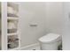 Convenient bathroom with toilet and shelving at 133 S Park Ave, Winter Garden, FL 34787