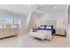 Bright bedroom with a plush bed, ceiling fan, and large windows at 133 S Park Ave, Winter Garden, FL 34787