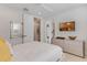 Bright bedroom with ensuite bath, large TV, and ample closet space at 133 S Park Ave, Winter Garden, FL 34787