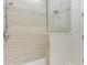 Clean shower with beige tile and glass enclosure at 133 S Park Ave, Winter Garden, FL 34787