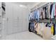 Bright walk-in closet with ample shelving and hanging space at 133 S Park Ave, Winter Garden, FL 34787