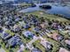 Single-story house with a large backyard in a golf course community near the water at 1369 Harley Cir, The Villages, FL 32162