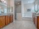 Elegant bathroom with double sinks, a large soaking tub and separate shower at 1369 Harley Cir, The Villages, FL 32162