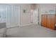 Spacious bedroom with double doors and ample closet space at 1369 Harley Cir, The Villages, FL 32162