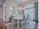 Formal dining room showcasing hardwood floors and a large window at 1369 Harley Cir, The Villages, FL 32162