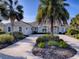 Beautiful home exterior with landscaping and driveway at 1369 Harley Cir, The Villages, FL 32162