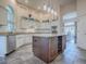 Gourmet kitchen with granite countertops and a wine rack at 1369 Harley Cir, The Villages, FL 32162