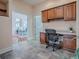 Home office with built-in cabinetry and view to dining room at 1369 Harley Cir, The Villages, FL 32162