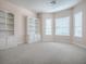 Bright office with built-in bookcases and window seat at 1369 Harley Cir, The Villages, FL 32162