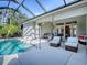 Lush landscaping surrounds this relaxing pool area at 1369 Harley Cir, The Villages, FL 32162