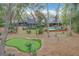 Home with pool, deck and putting green in wooded lot at 1701 Cedar Stone Ct, Lake Mary, FL 32746