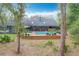 Aerial view of pool and deck, providing a perfect setting for relaxation and outdoor gatherings at 1701 Cedar Stone Ct, Lake Mary, FL 32746