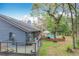 View of home with wooden deck overlooking an inviting in-ground pool at 1701 Cedar Stone Ct, Lake Mary, FL 32746