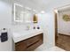 Modern bathroom with floating vanity and illuminated mirror at 1701 Cedar Stone Ct, Lake Mary, FL 32746