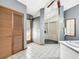 Modern bathroom with a glass-enclosed shower and a combination of gray walls and gray tile flooring at 1701 Cedar Stone Ct, Lake Mary, FL 32746