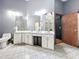 Bathroom featuring a double sink vanity, gray flooring, and an adjacent walk-in shower at 1701 Cedar Stone Ct, Lake Mary, FL 32746