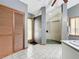 Bathroom with walk-in shower, double sinks, and wood louvered doors at 1701 Cedar Stone Ct, Lake Mary, FL 32746