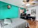 Bedroom featuring wood floors, a bed, a ceiling fan, a desk, and a stylish accent wall at 1701 Cedar Stone Ct, Lake Mary, FL 32746