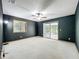 Bedroom features neutral paint, carpet flooring, a window and sliding glass door at 1701 Cedar Stone Ct, Lake Mary, FL 32746