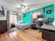 Comfortable bedroom featuring hardwood floors, a ceiling fan, and a modern design at 1701 Cedar Stone Ct, Lake Mary, FL 32746