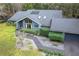 Aerial shot of a well-maintained house with a dark gray roof and neat landscaping at 1701 Cedar Stone Ct, Lake Mary, FL 32746