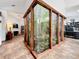 View of the indoor courtyard with glass walls, foliage, and natural light at 1701 Cedar Stone Ct, Lake Mary, FL 32746