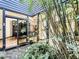 Indoor garden boasting lush foliage and bamboo shoots, visible through the surrounding home, enhancing the home's connection with nature at 1701 Cedar Stone Ct, Lake Mary, FL 32746