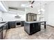Kitchen featuring an island, stainless appliances, and an atrium at 1701 Cedar Stone Ct, Lake Mary, FL 32746