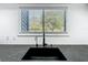 Modern kitchen countertop with a sink, faucet and a window at 1701 Cedar Stone Ct, Lake Mary, FL 32746