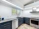 Kitchen featuring stainless steel appliances, stone countertops, and custom cabinets at 1701 Cedar Stone Ct, Lake Mary, FL 32746