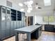 Large kitchen features custom cabinetry, an island with marble countertops, and stainless steel appliances at 1701 Cedar Stone Ct, Lake Mary, FL 32746