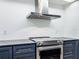 Modern kitchen featuring stainless steel oven and custom cabinets at 1701 Cedar Stone Ct, Lake Mary, FL 32746