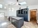 Eat-in kitchen area with custom cabinets, a large island, and views to the outdoor area at 1701 Cedar Stone Ct, Lake Mary, FL 32746