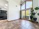 Bright living room with ceramic tile flooring, large windows, and natural light at 1701 Cedar Stone Ct, Lake Mary, FL 32746