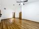 Bright living room with ceiling fan, hardwood floors and white walls, creating a modern feel at 1701 Cedar Stone Ct, Lake Mary, FL 32746
