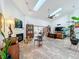 Large living room with a fireplace, mid-century modern accents, and tile flooring at 1701 Cedar Stone Ct, Lake Mary, FL 32746